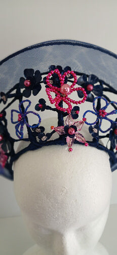 A picture of a Navy and Pink Beaded Crinoline Crown by Melissa Rath Millinery.