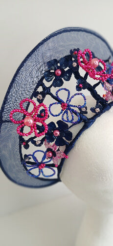 A picture of a Navy and Pink Beaded Crinoline Crown by Melissa Rath Millinery.