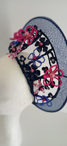 A picture of a Navy and Pink Beaded Crinoline Crown by Melissa Rath Millinery.