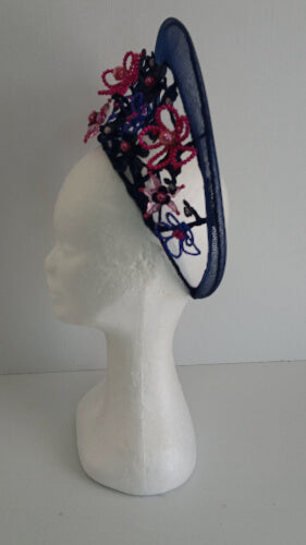 A picture of a Navy and Pink Beaded Crinoline Crown by Melissa Rath Millinery.