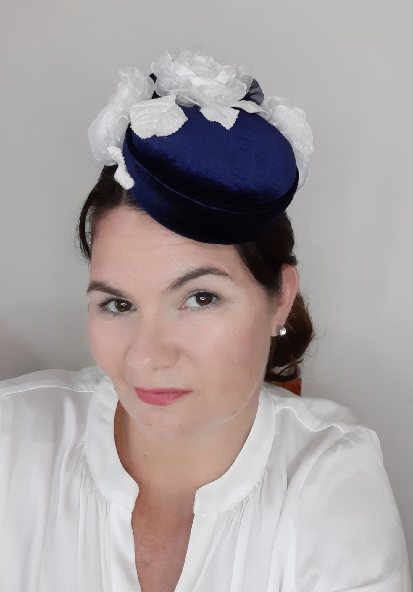 A picture of a Navy and White Velvet Millinery Fascinator by Melissa Rath Millinery.