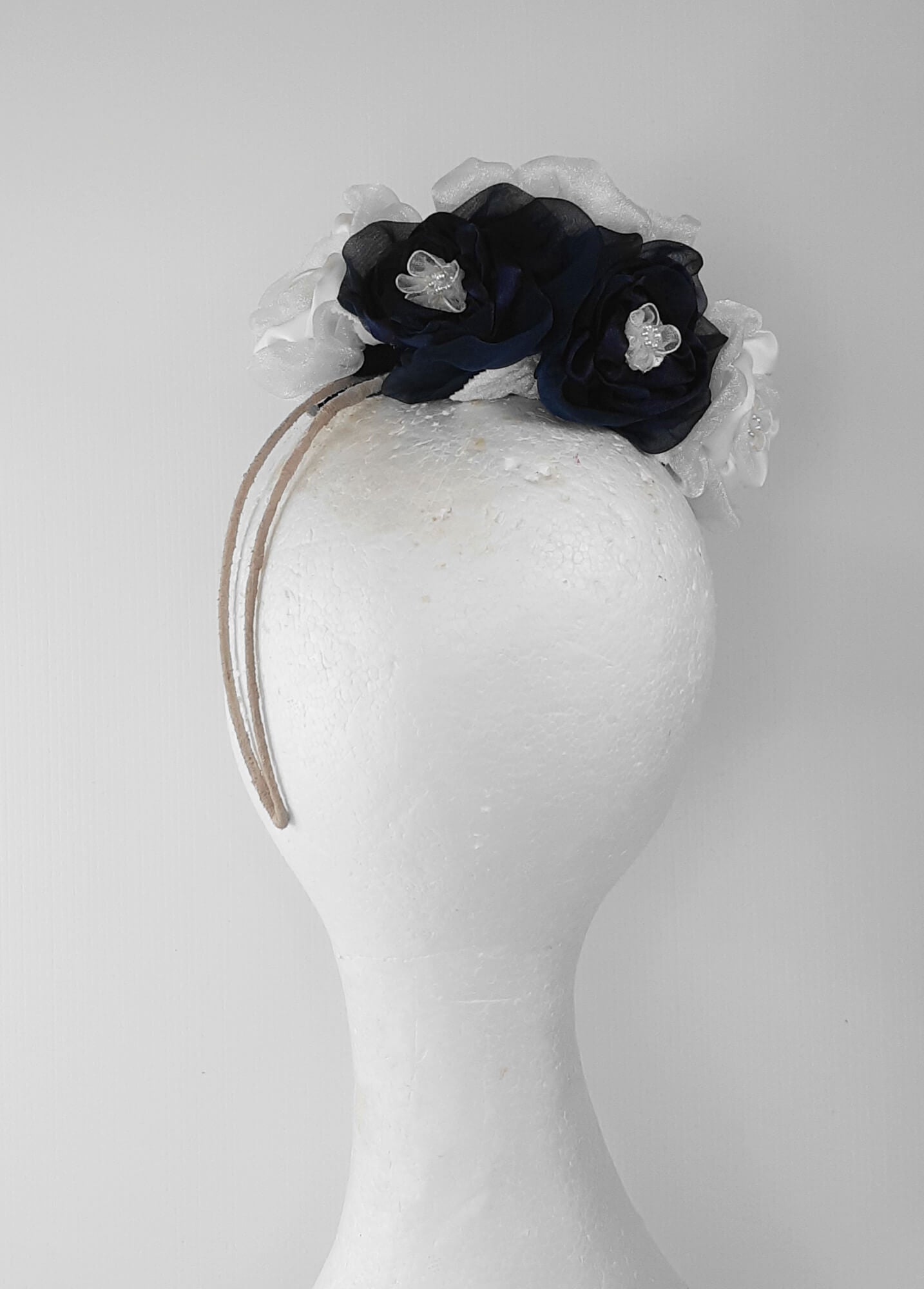 A picture of a Navy and White Velvet Millinery Fascinator by Melissa Rath Millinery.