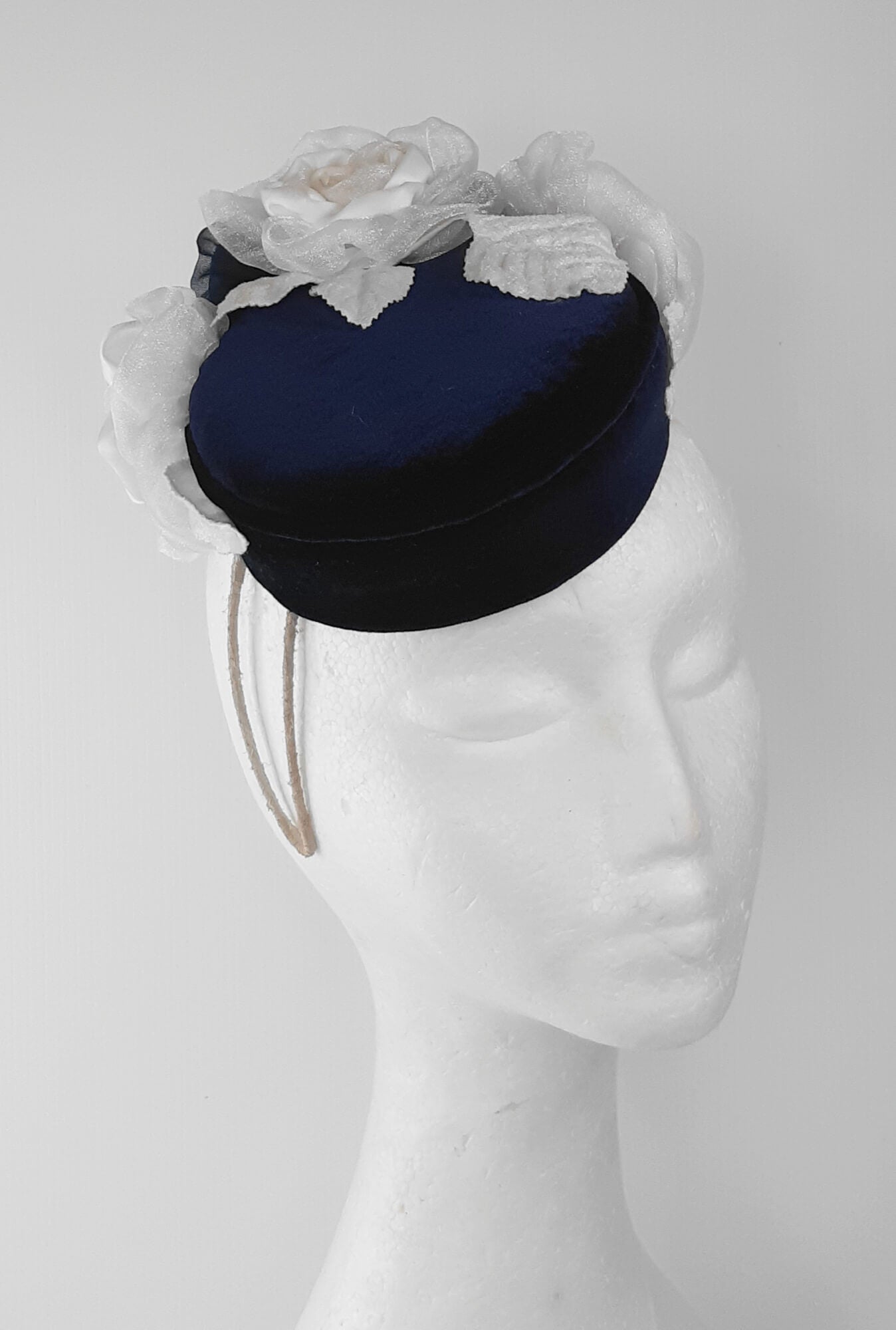 A picture of a Navy and White Velvet Millinery Fascinator by Melissa Rath Millinery.
