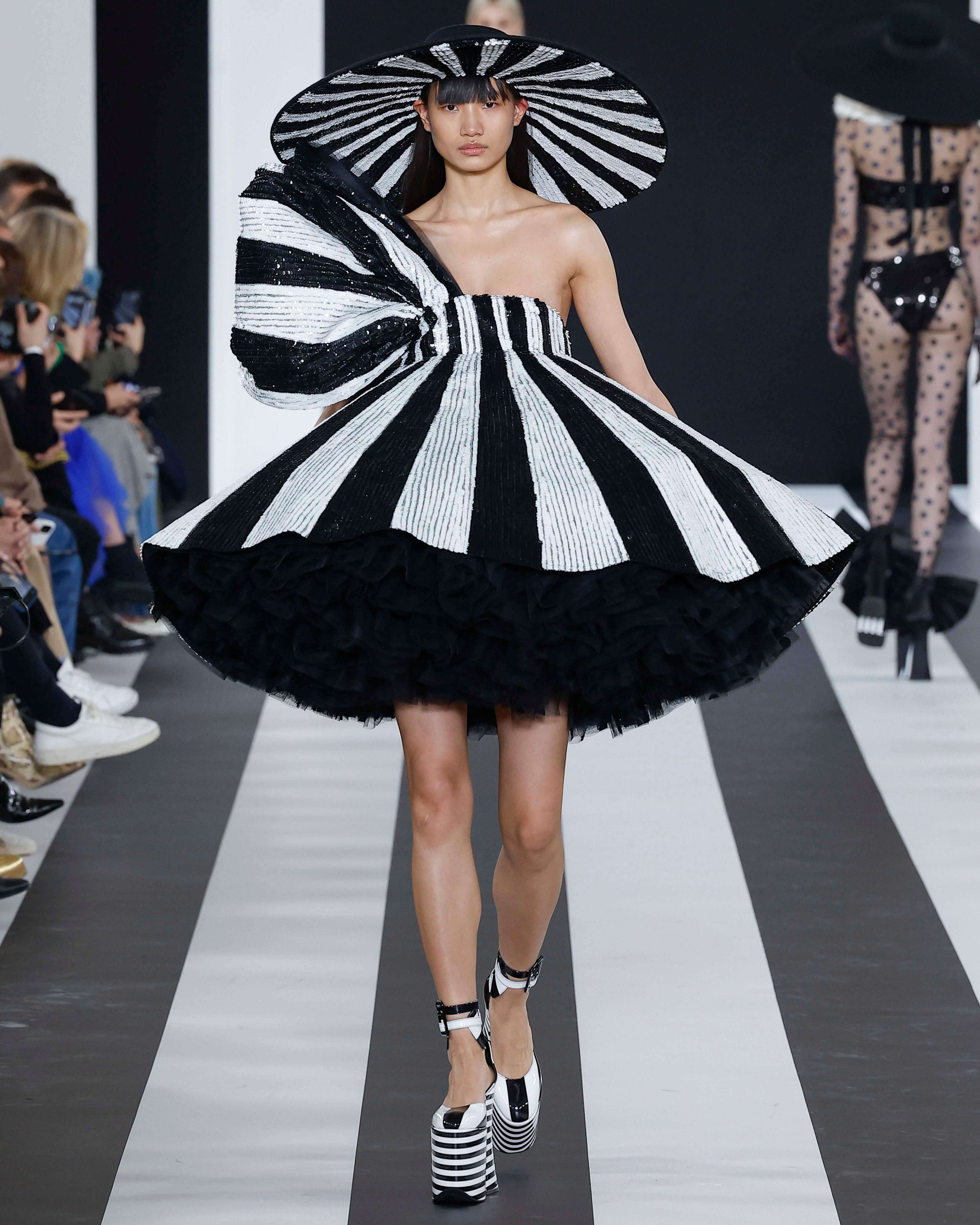 A picture of a model on the catwalk for Nina Ricci AW 2023.