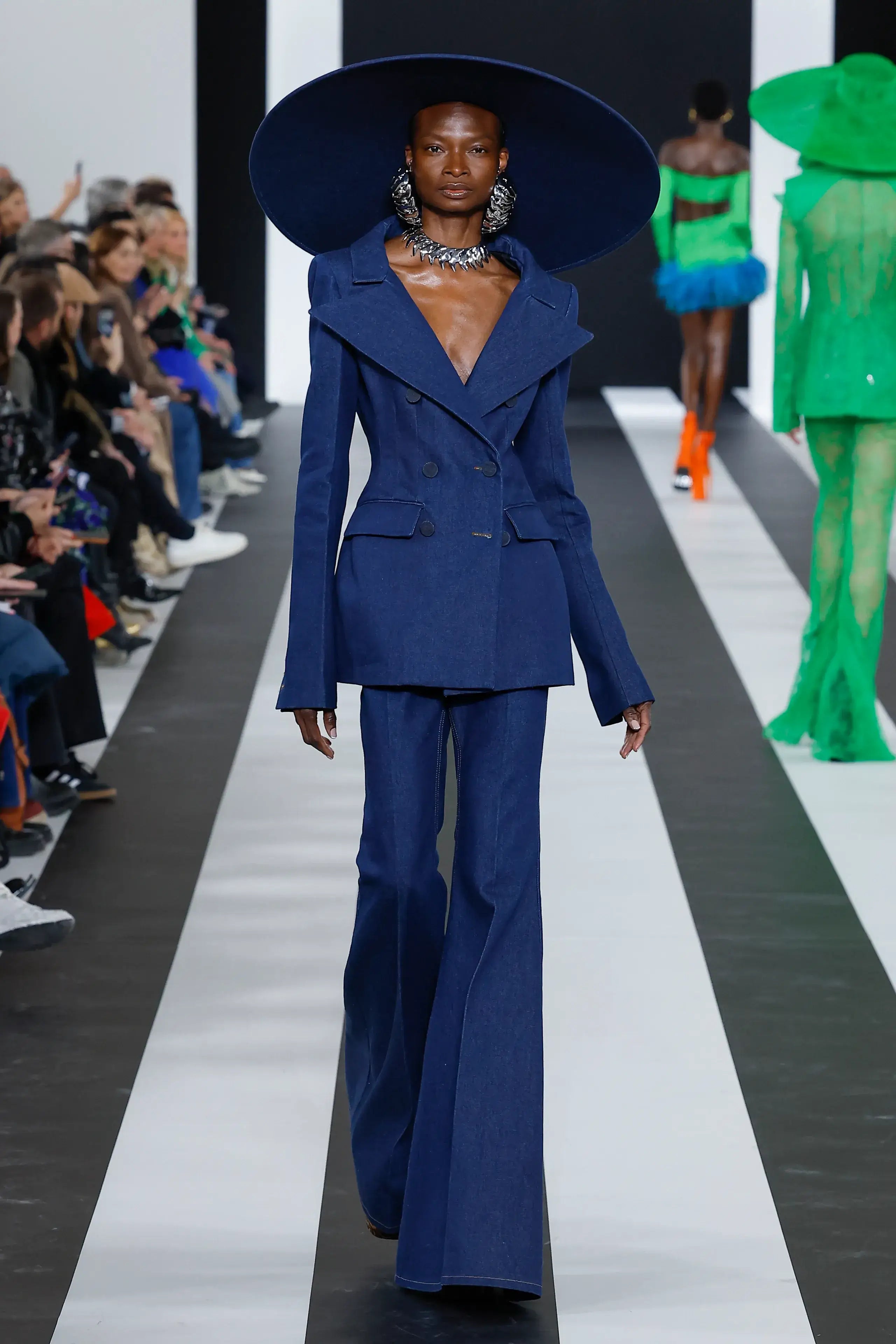 A picture of a model on the catwalk for Nina Ricci AW 2023.