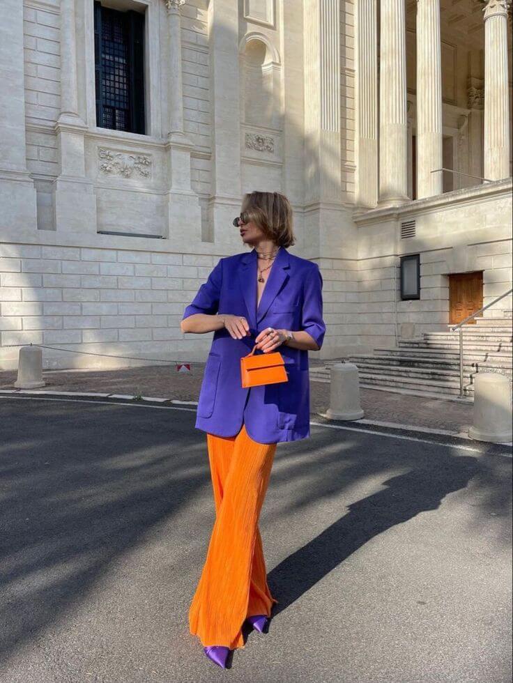 A picture of a woman wearing an outfit in an orange complementary colour scheme.