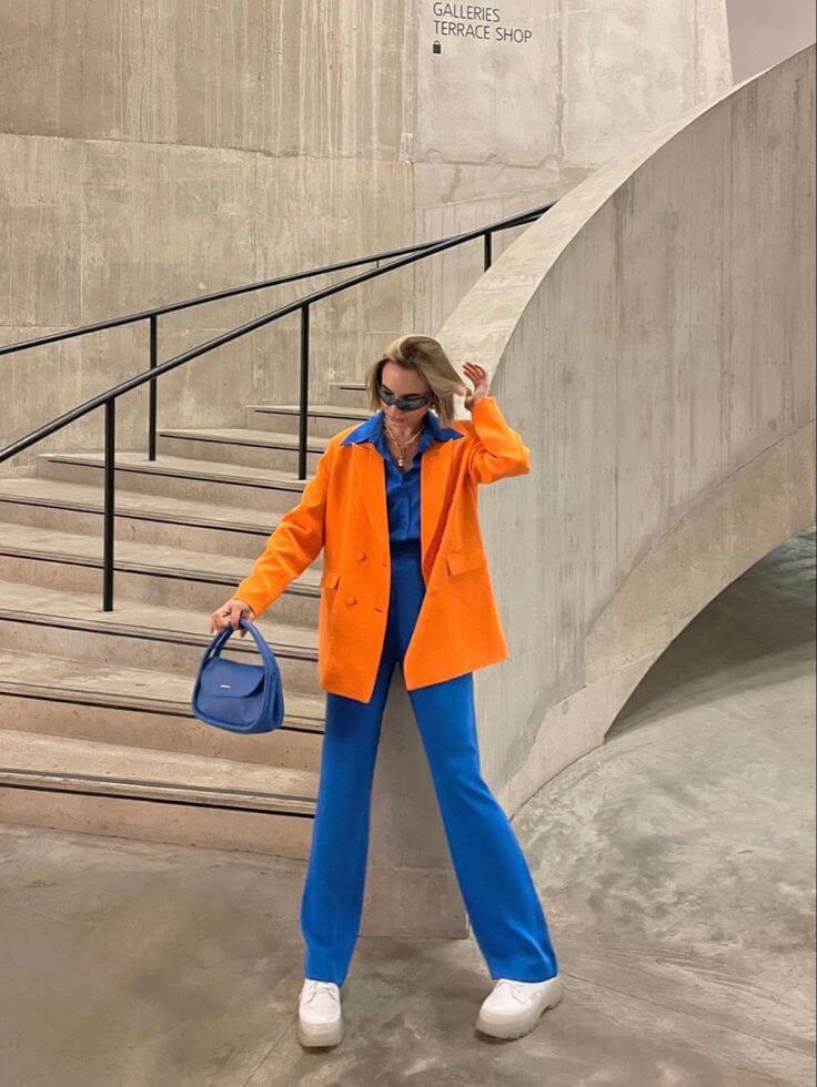 A picture of a woman wearing an outfit in an orange complementary colour scheme.