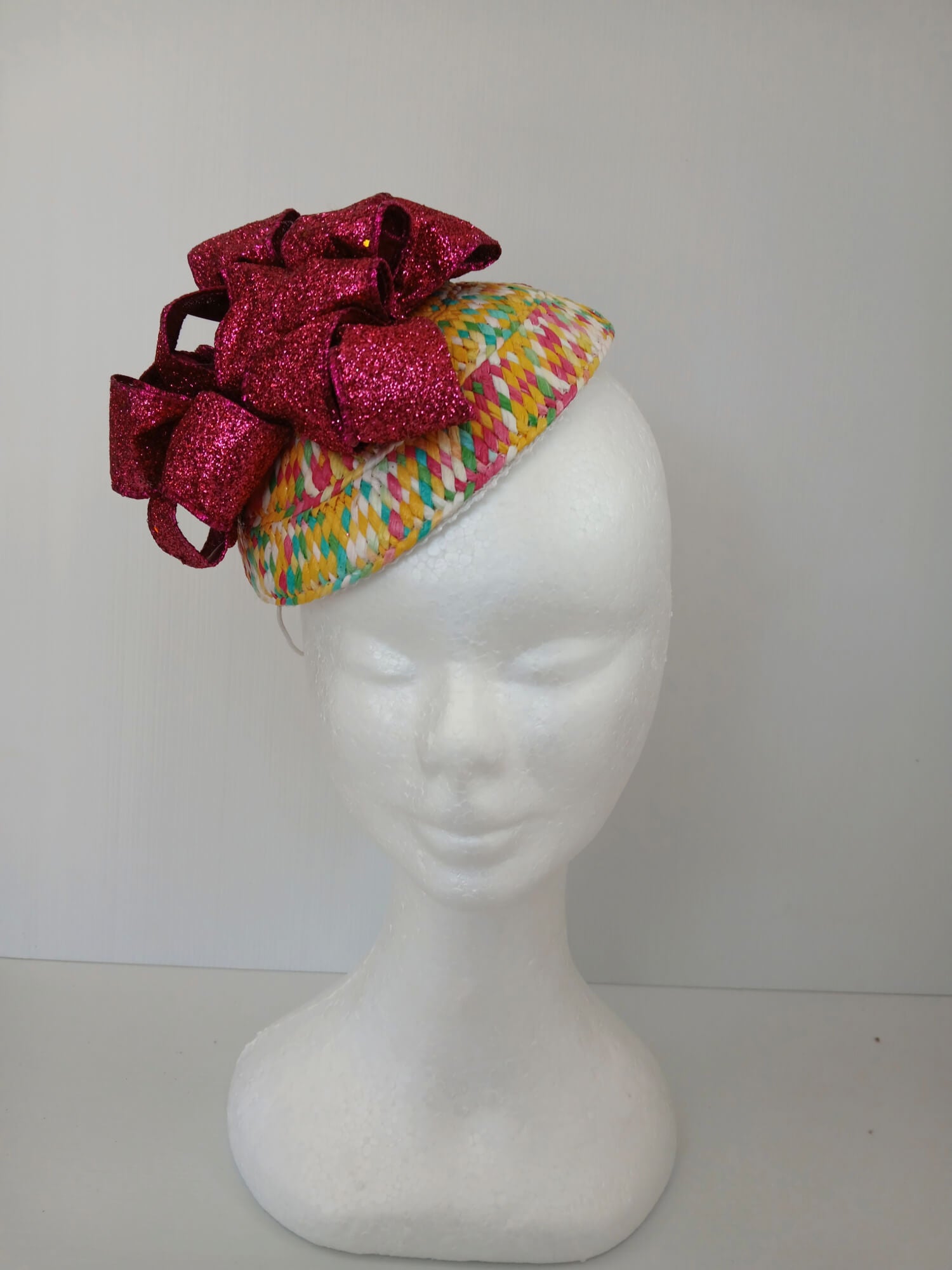 A picture of a Paper Braid Fascinator by Melissa Rath Millinery.