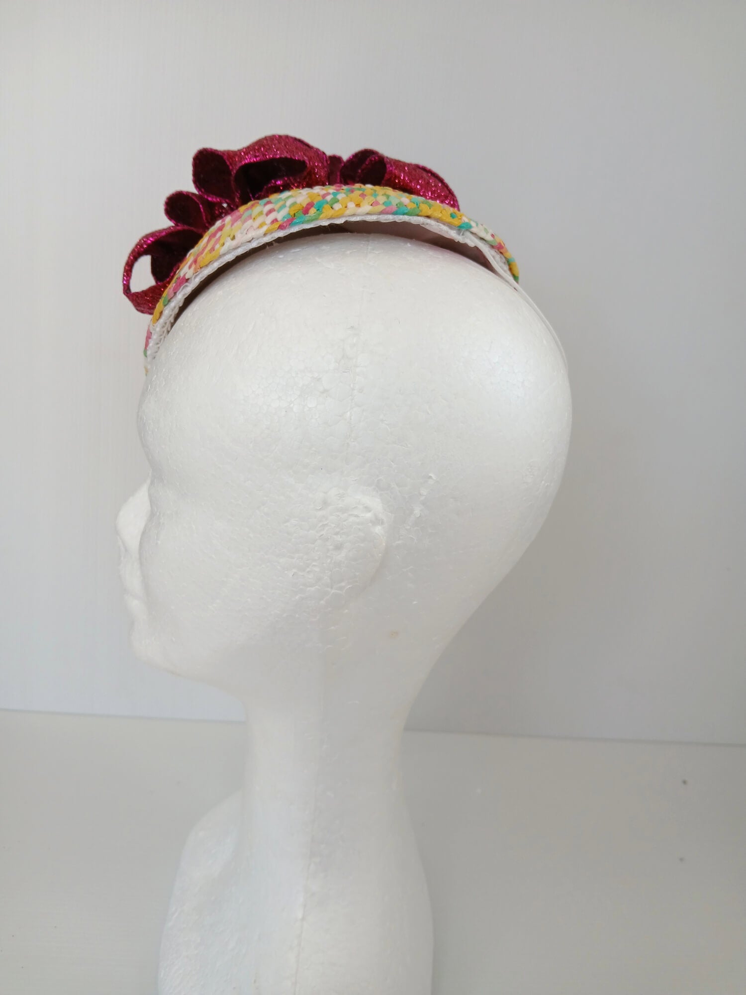 A picture of a Paper Braid Fascinator by Melissa Rath Millinery.