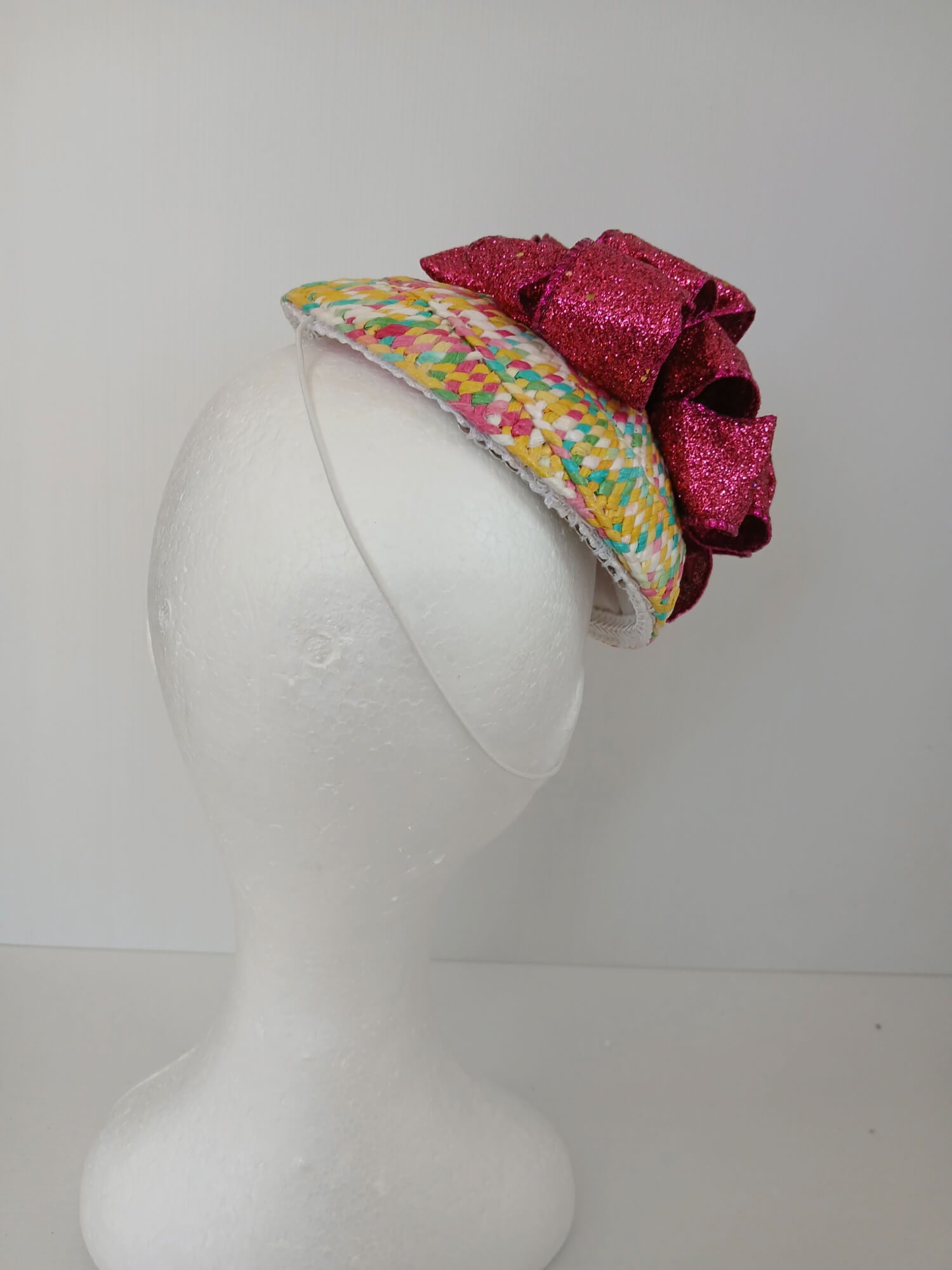 A picture of a Paper Braid Fascinator by Melissa Rath Millinery.