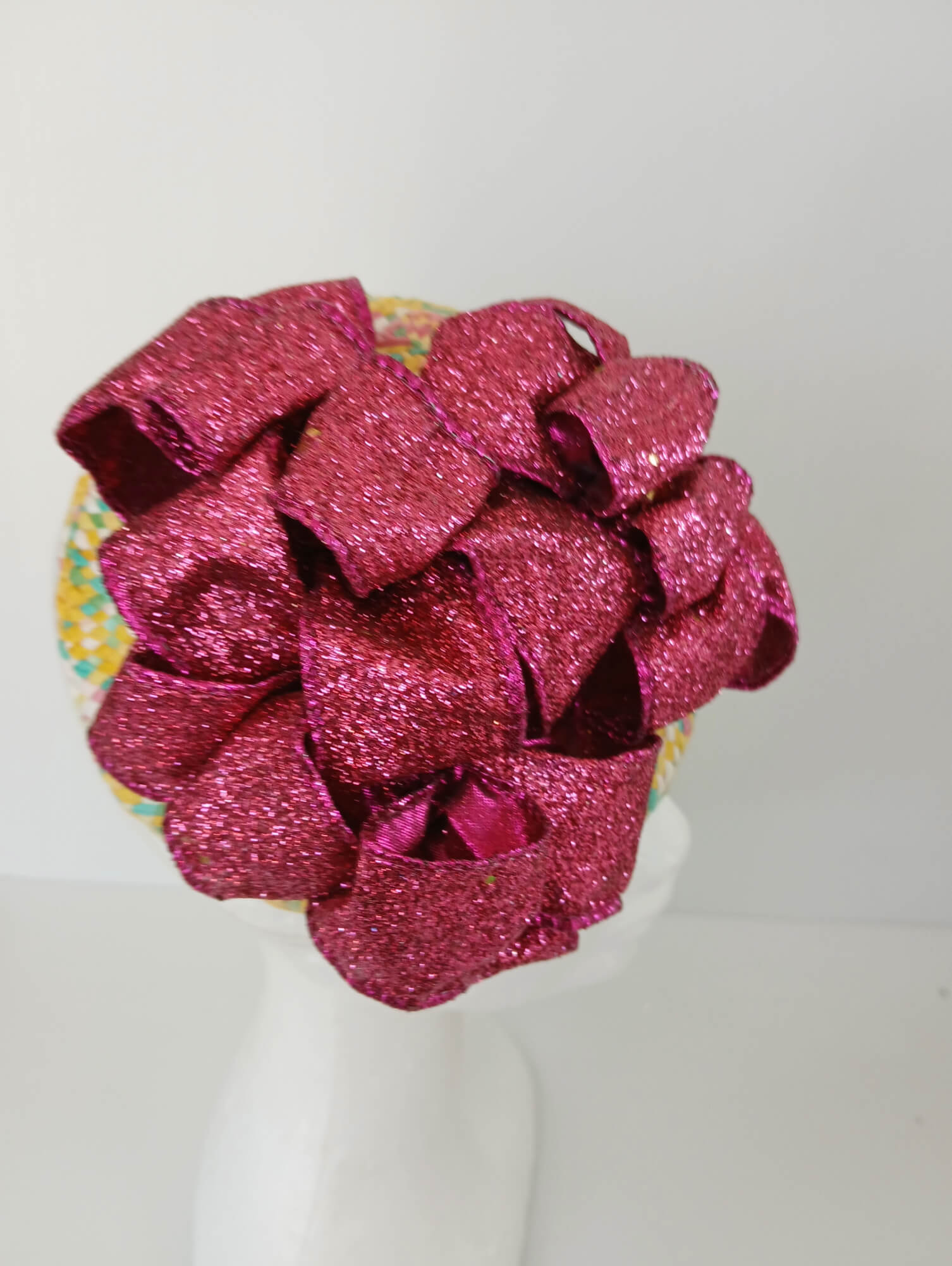 A picture of a Paper Braid Fascinator by Melissa Rath Millinery.