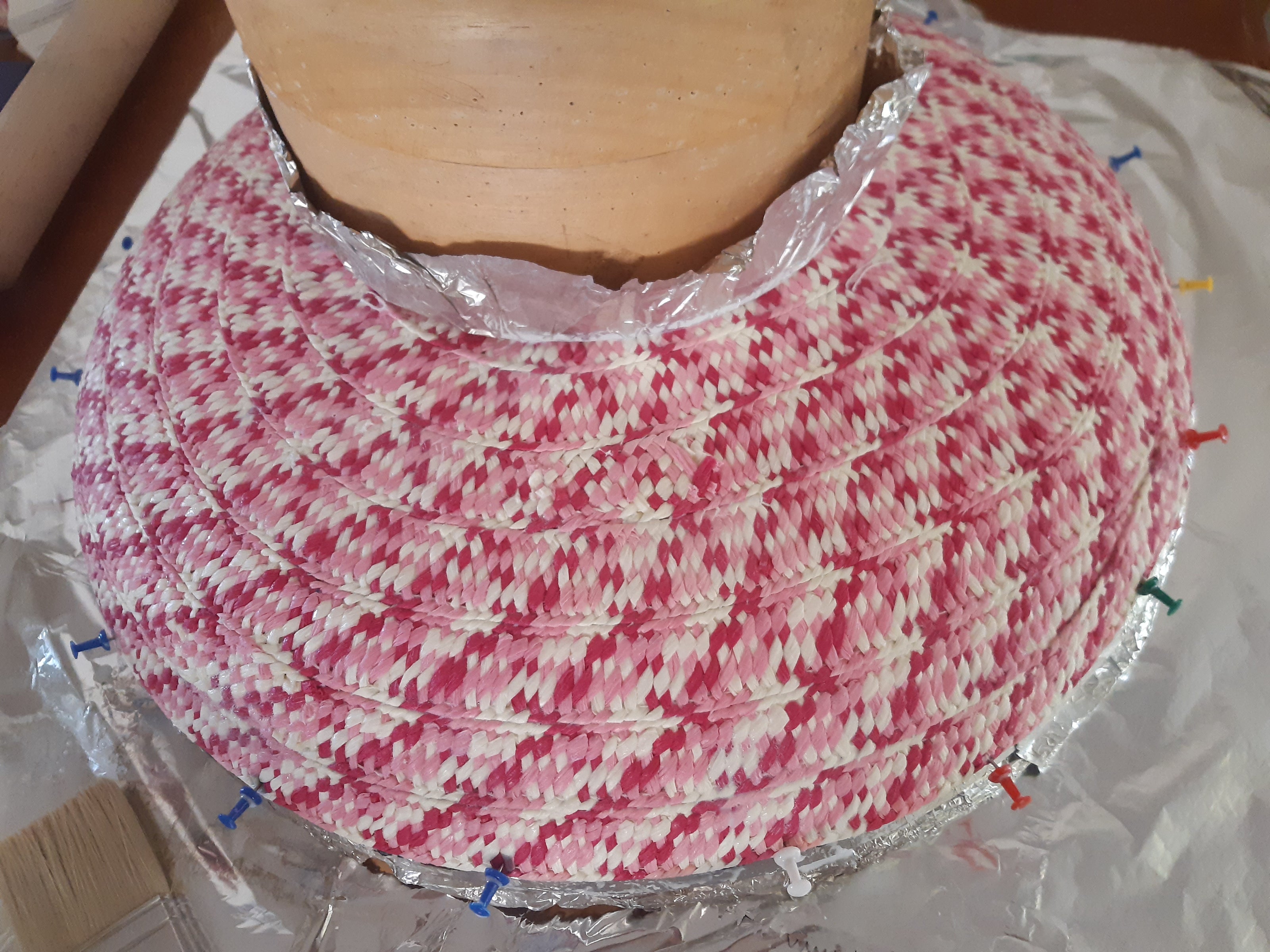 A picture of the making of the Paper Braid Wide Brimmed Hat by Melissa Rath Millinery.