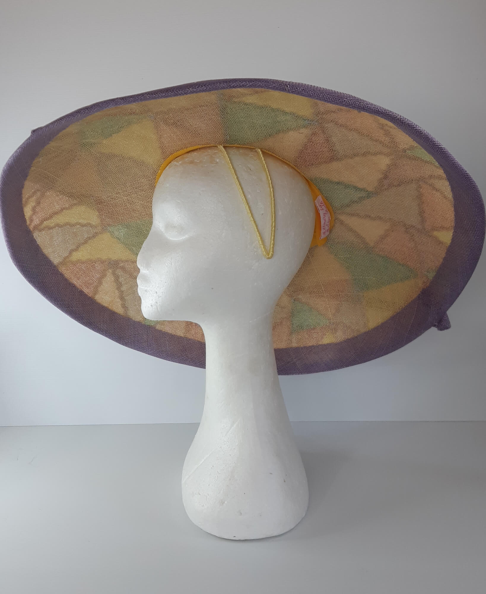 A picture of a wide brim patchwork hat by Melissa Rath Millinery.