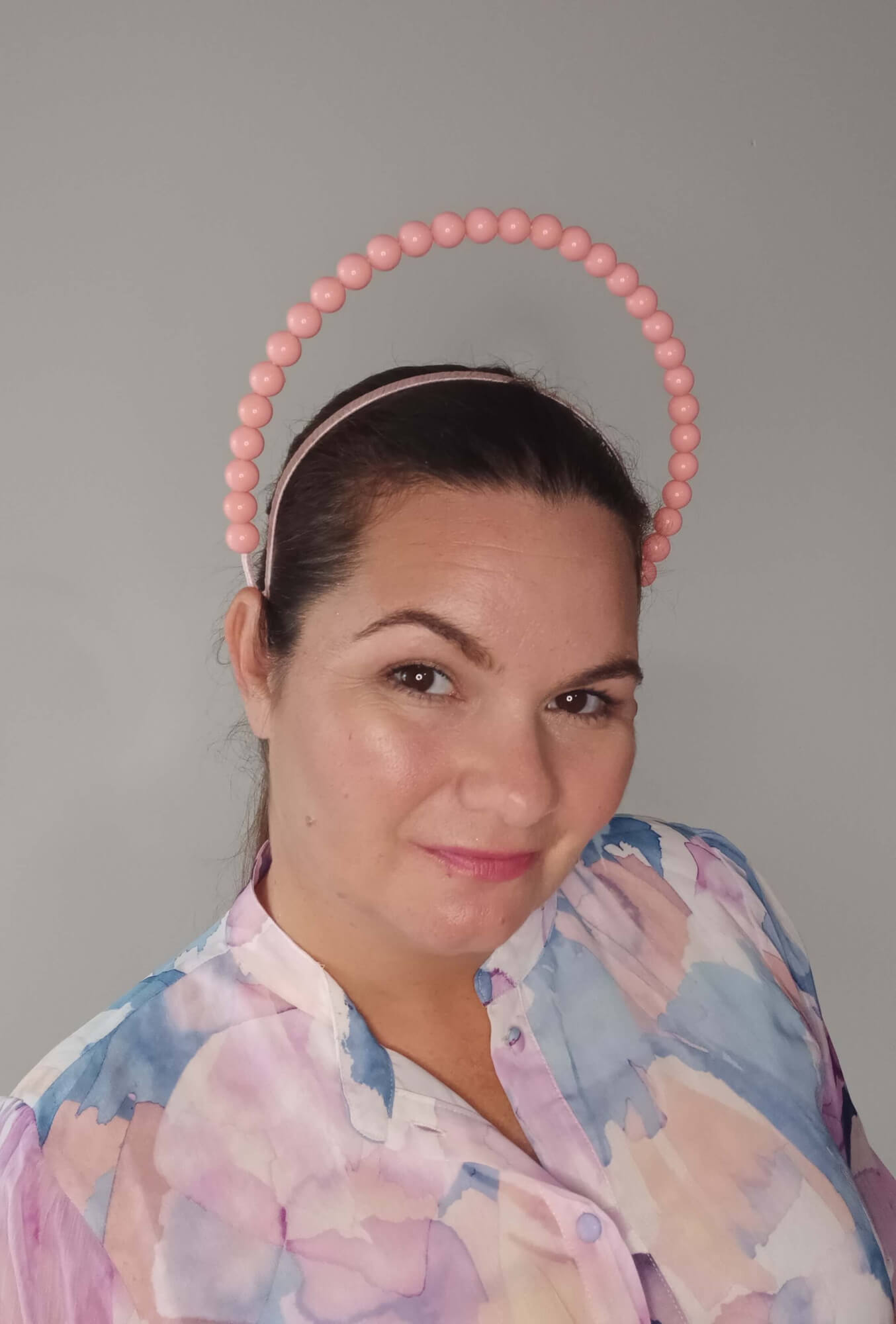 A picture of an Apricot Beaded Headband by Melissa Rath Millinery.