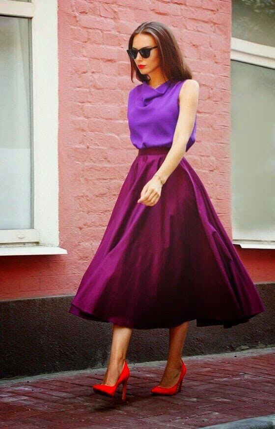 A picture of a woman wearing an outfit in a pink analogous colour scheme.