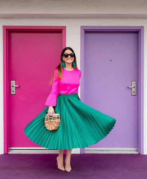 A picture of a woman wearing an outfit in a pink complementary colour scheme.