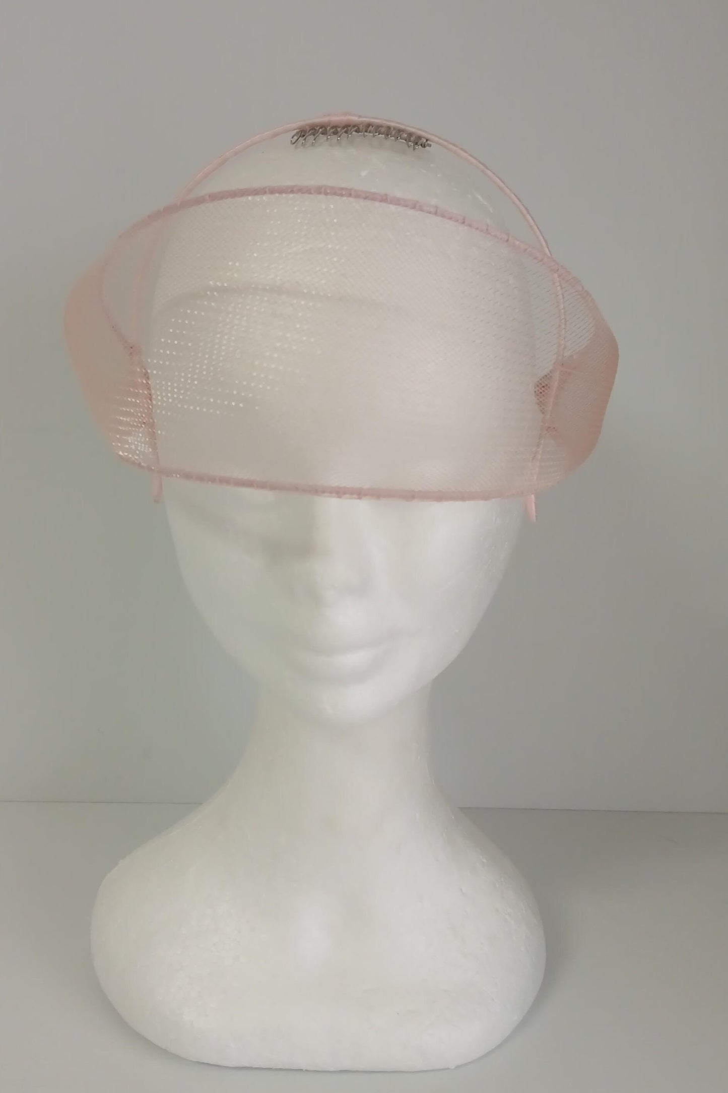 A picture of a light pink crinoline millinery veil by Melissa Rath Millinery