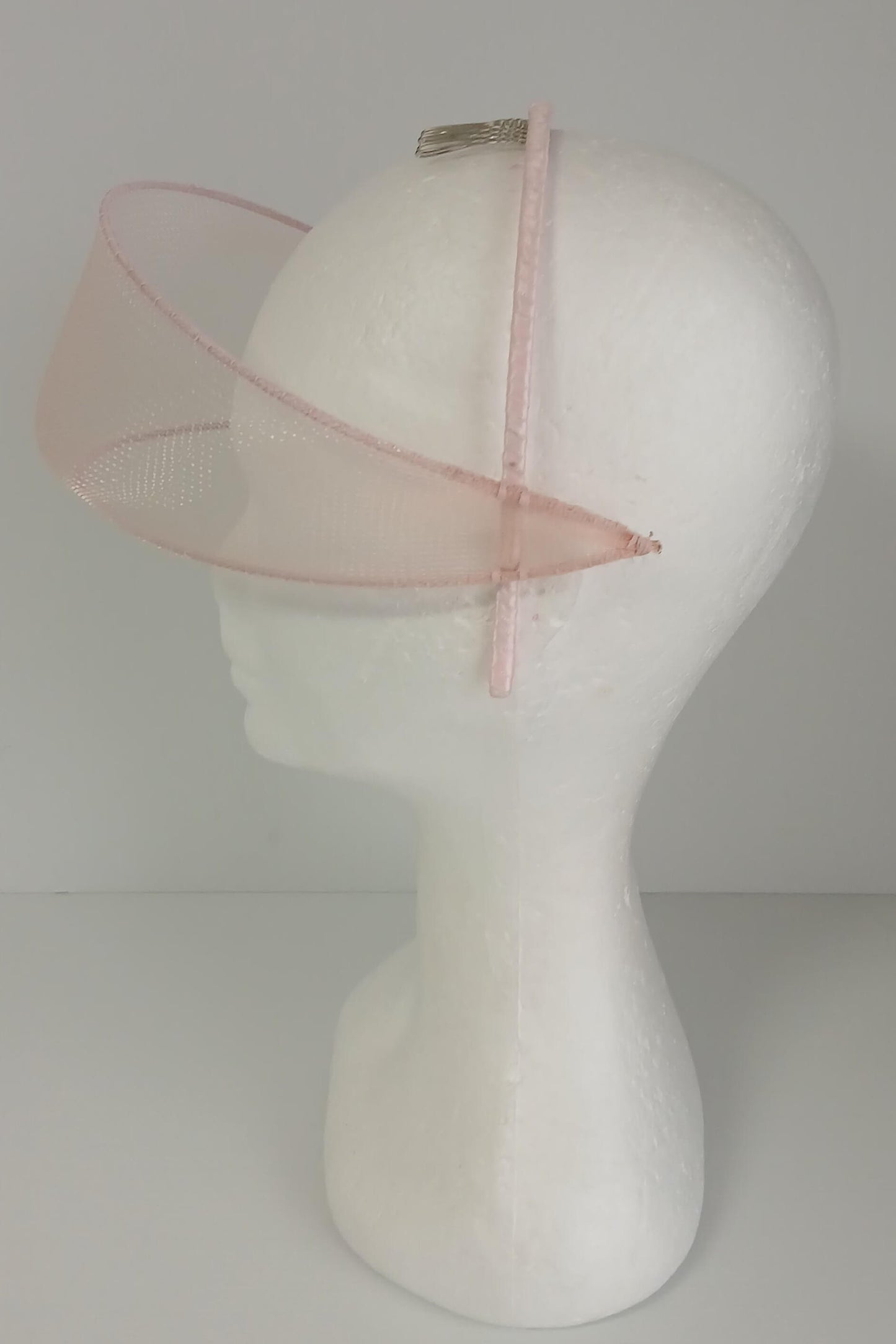 A picture of a light pink crinoline millinery veil by Melissa Rath Millinery
