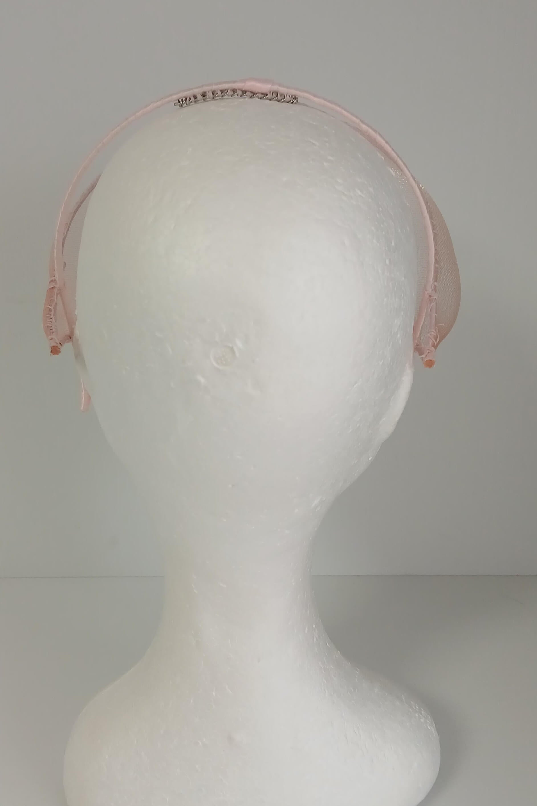 A picture of a light pink crinoline millinery veil by Melissa Rath Millinery