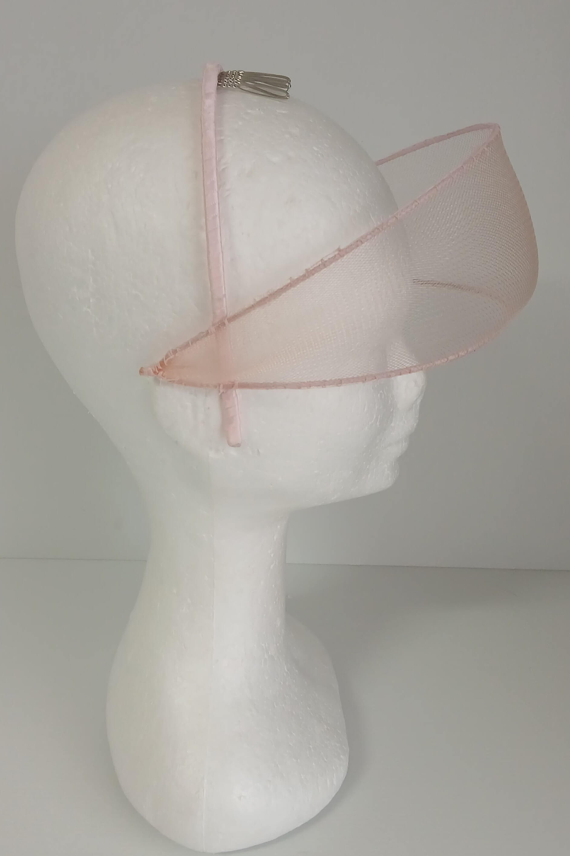A picture of a light pink crinoline millinery veil by Melissa Rath Millinery