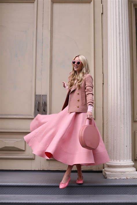 A picture of a woman wearing an outfit in a pink monochromatic colour scheme.