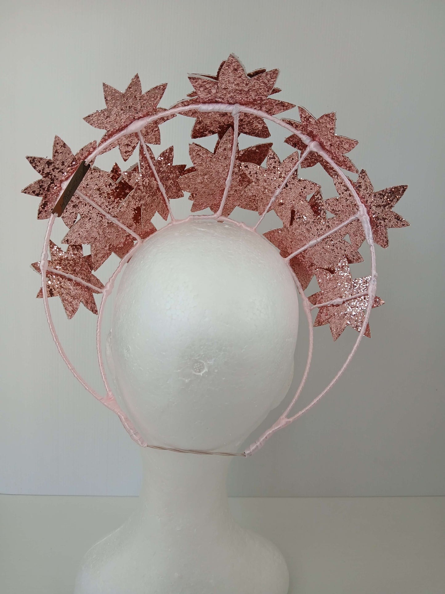 A picture of a Pink Pleather Millinery Crown by Melissa Rath Millinery