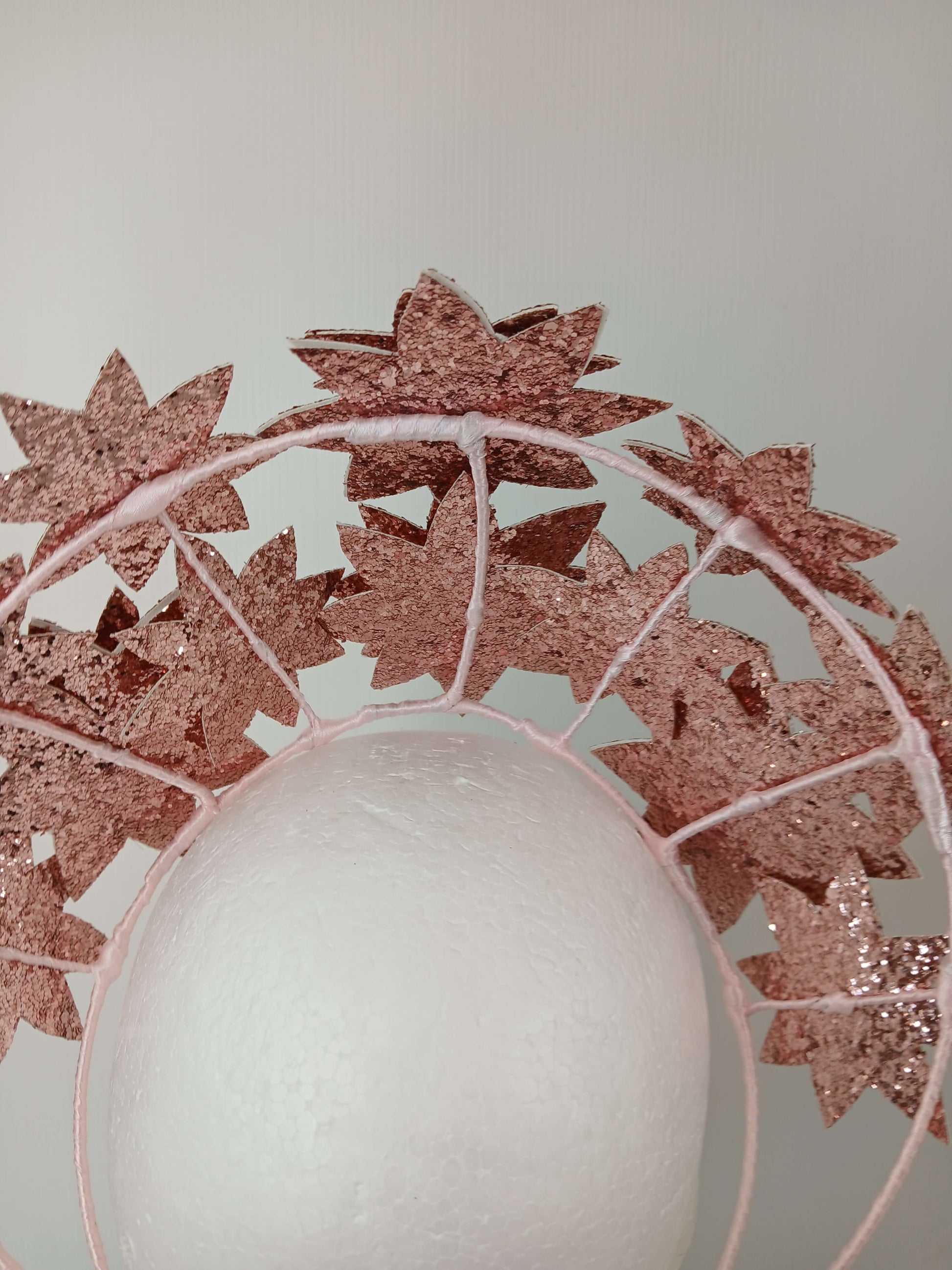 A picture of a Pink Pleather Millinery Crown by Melissa Rath Millinery