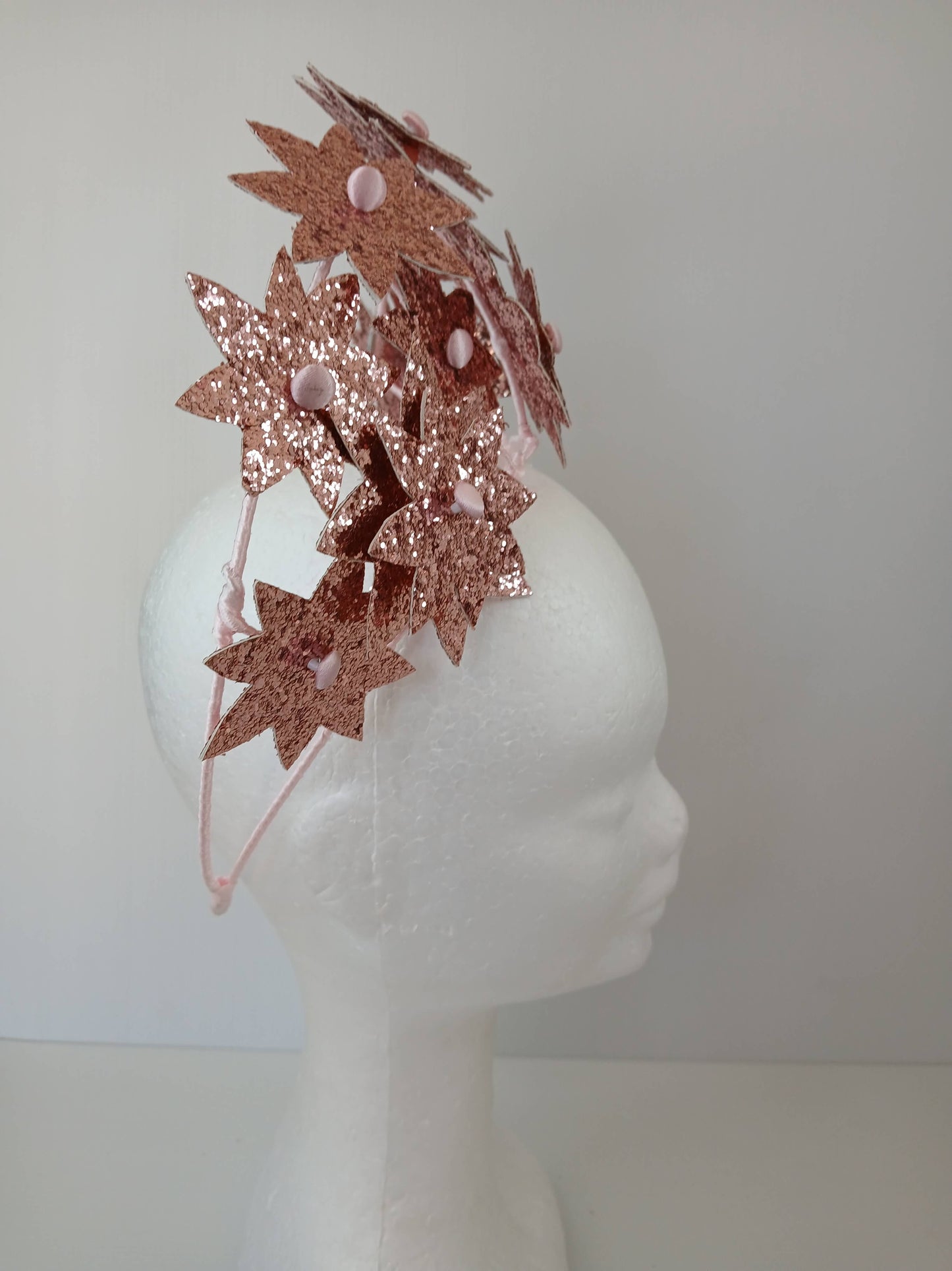 A picture of a Pink Pleather Millinery Crown by Melissa Rath Millinery