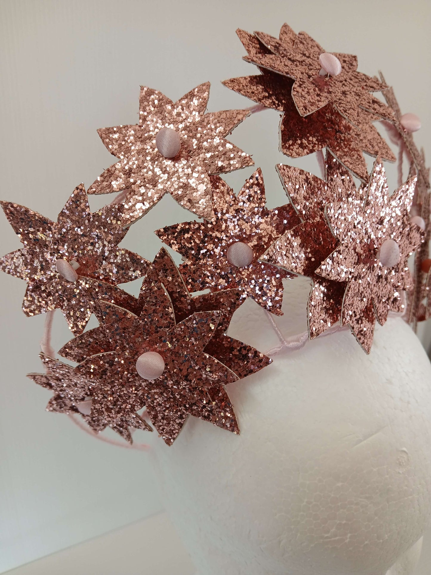 A picture of a Pink Pleather Millinery Crown by Melissa Rath Millinery