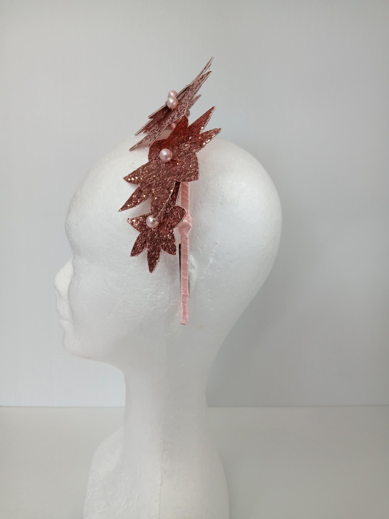 A picture of a Pink Pleather Millinery Headband by Melissa Rath Millinery