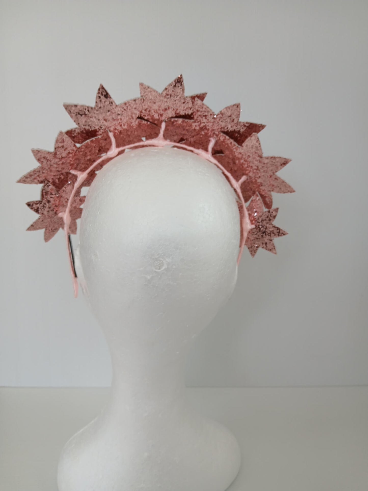 A picture of a Pink Pleather Millinery Headband by Melissa Rath Millinery