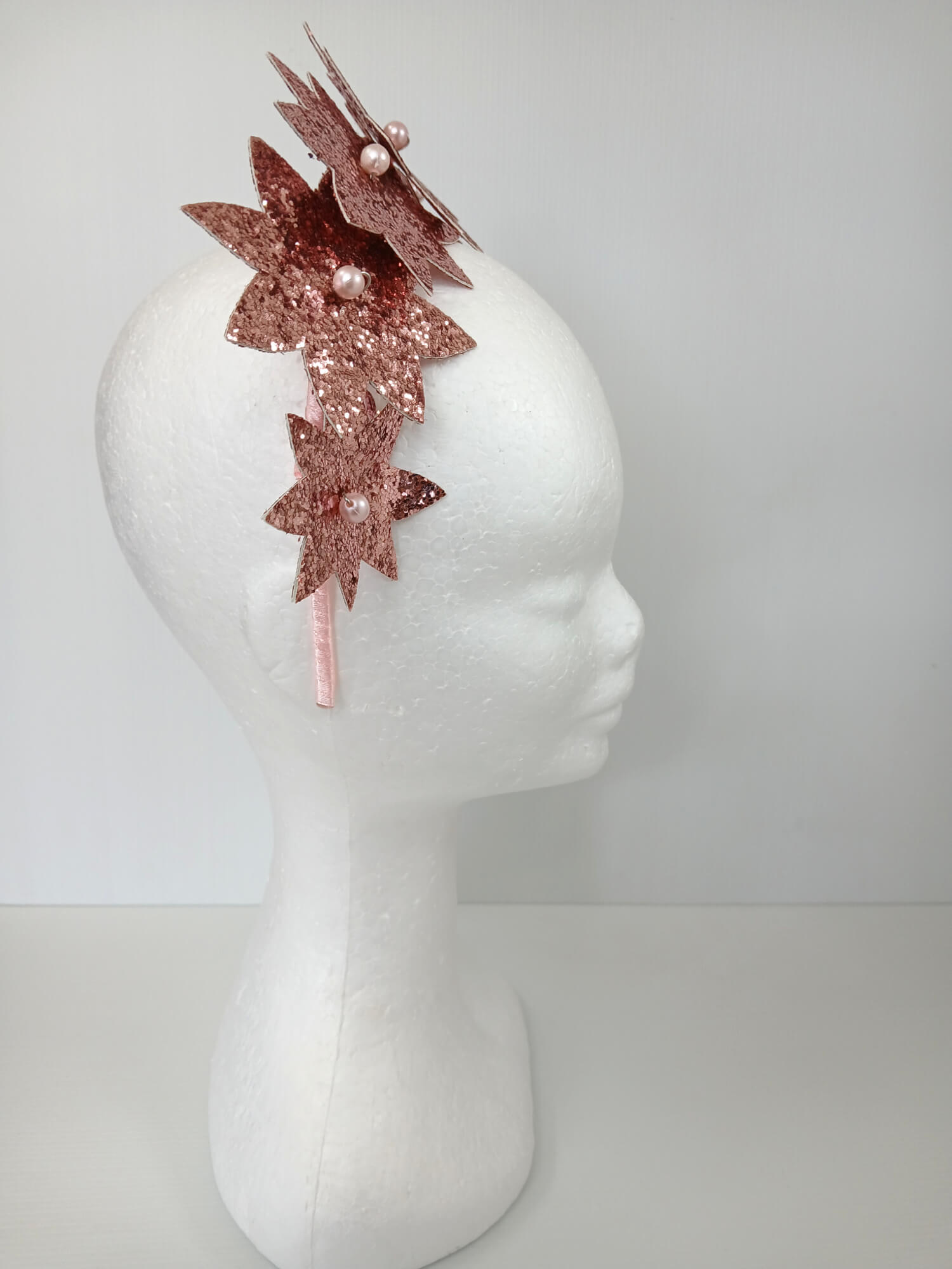 A picture of a Pink Pleather Millinery Headband by Melissa Rath Millinery