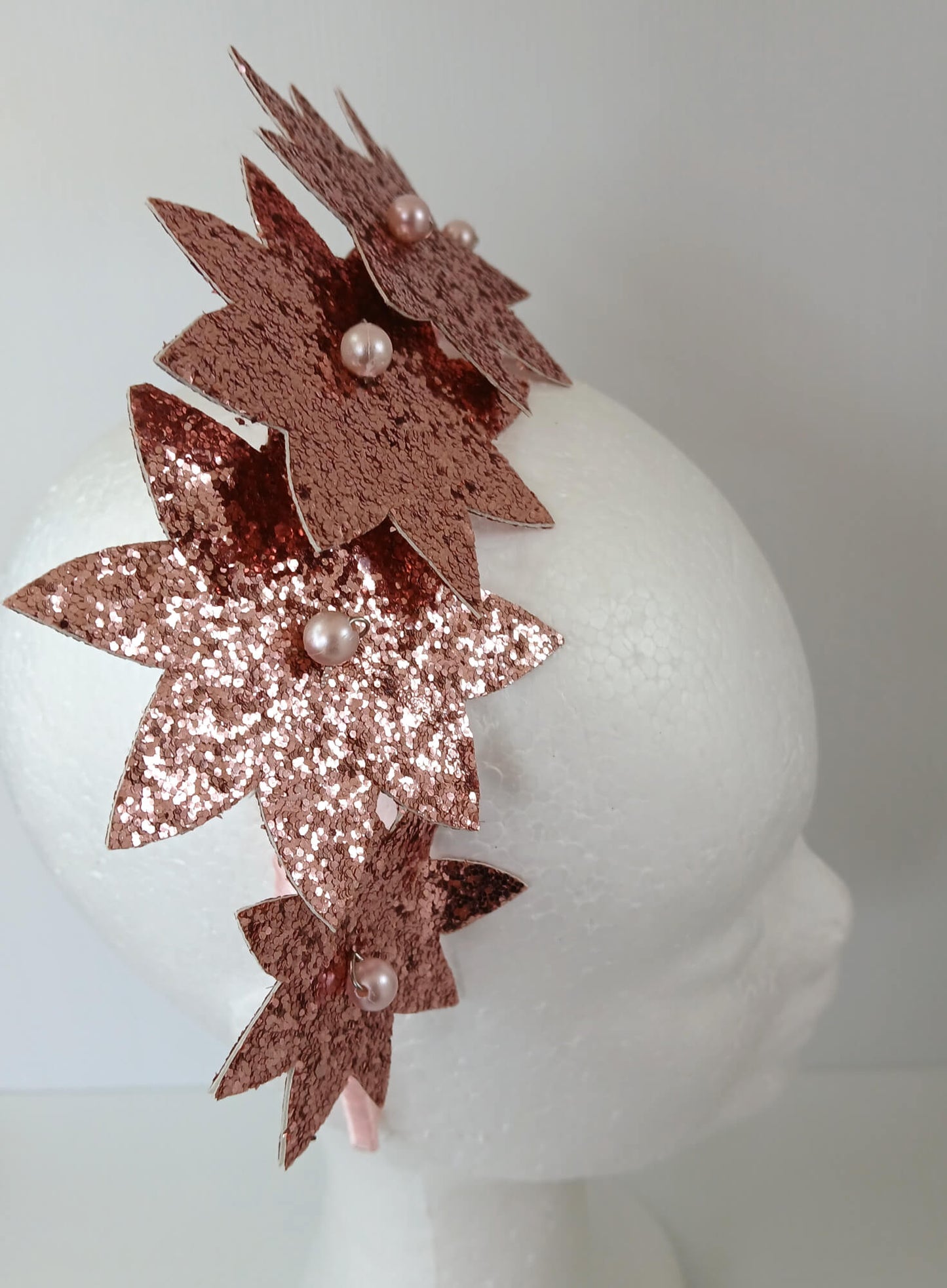 A picture of a Pink Pleather Millinery Headband by Melissa Rath Millinery
