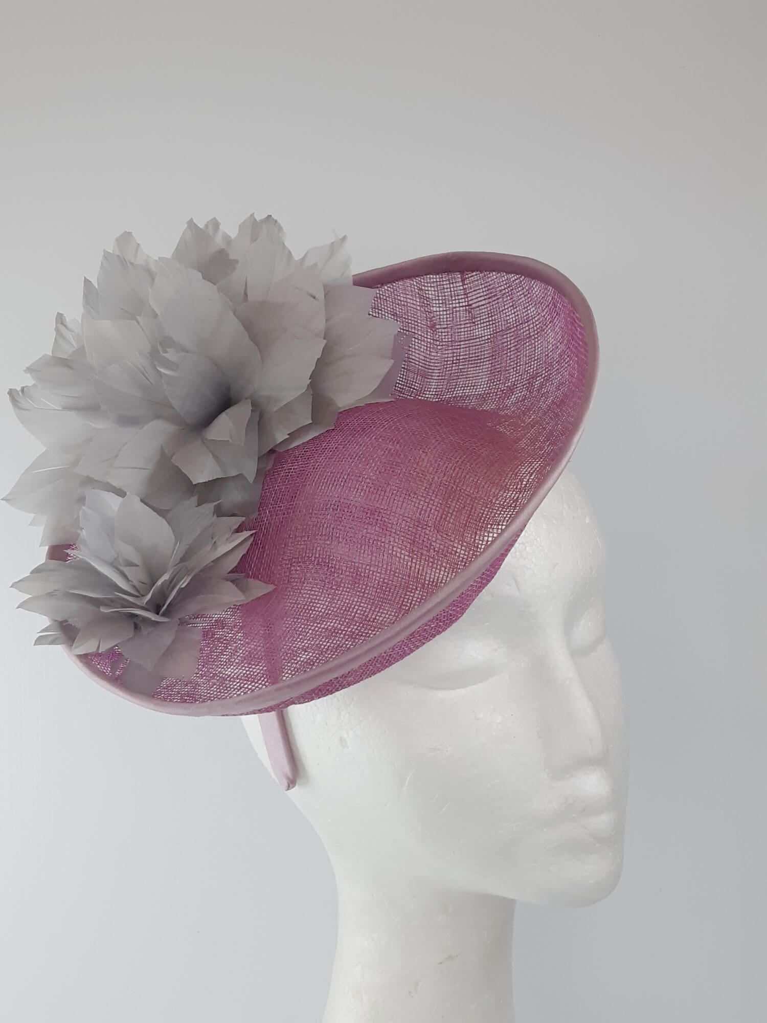 A picture of a Pink and Silver Saucer hat by Melissa Rath Millinery.