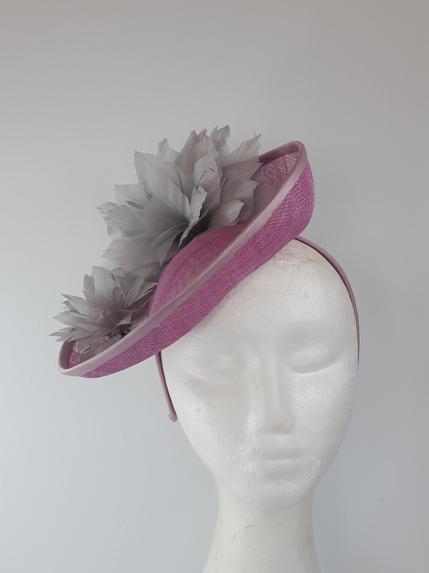 A picture of a Pink and Silver Saucer hat by Melissa Rath Millinery.