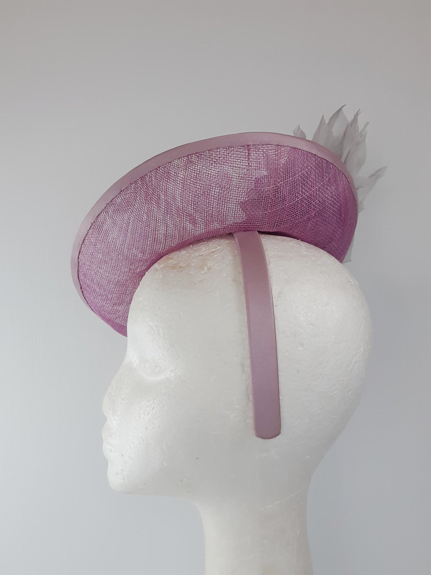 A picture of a Pink and Silver Saucer hat by Melissa Rath Millinery.
