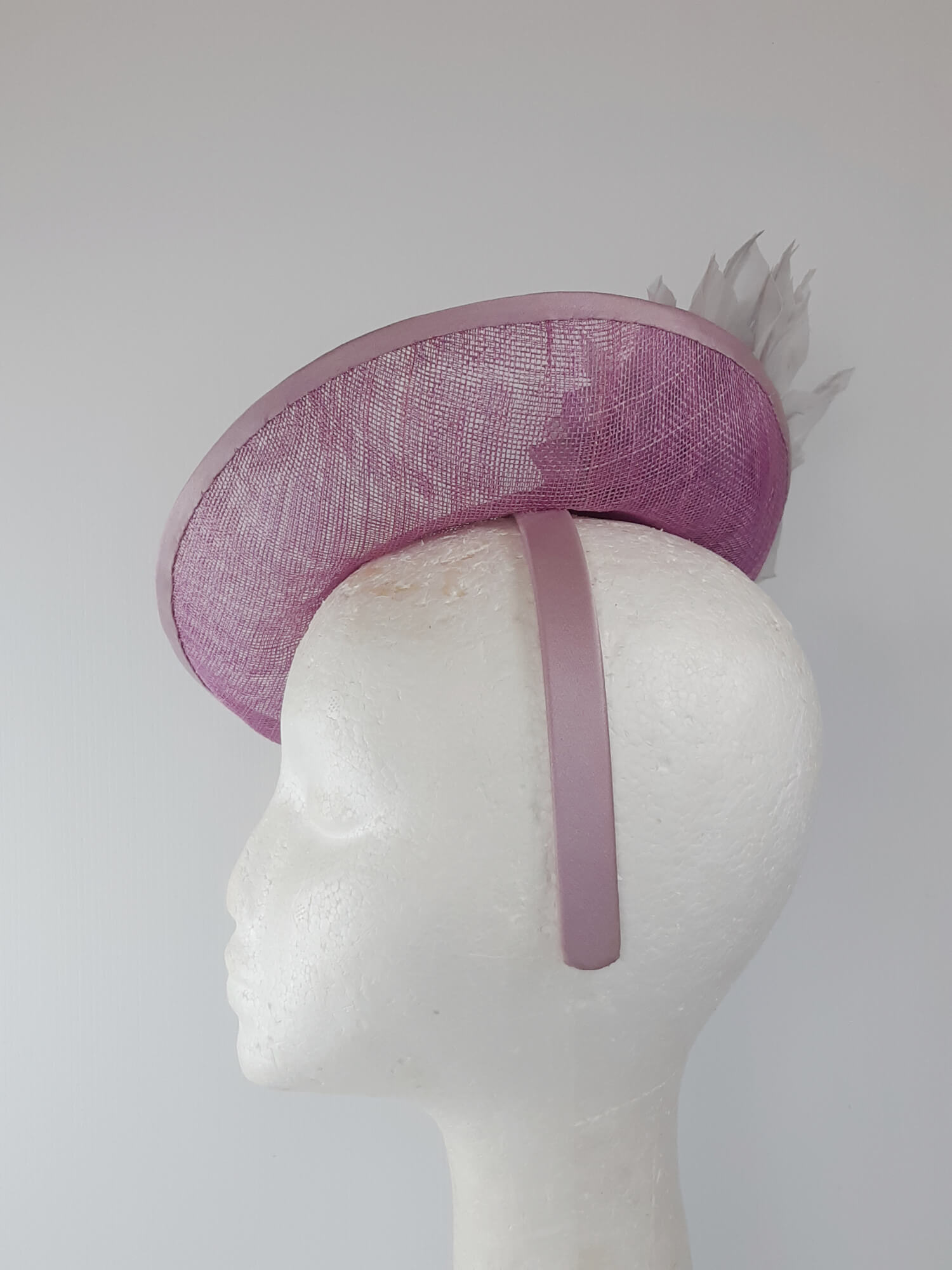 A picture of a Pink and Silver Saucer hat by Melissa Rath Millinery.