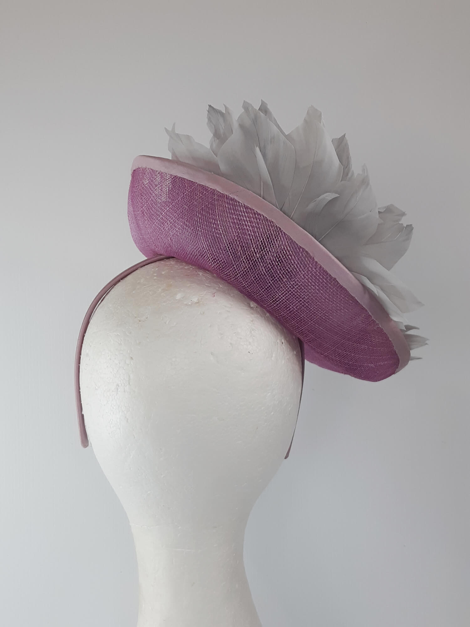 A picture of a Pink and Silver Saucer hat by Melissa Rath Millinery.