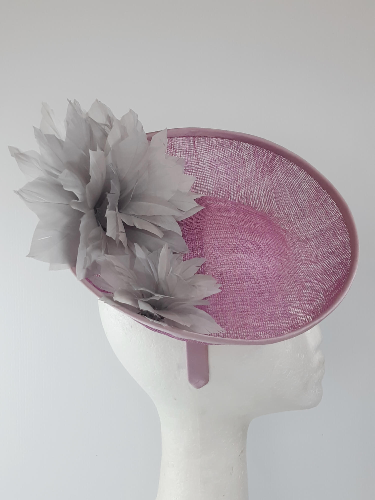 A picture of a Pink and Silver Saucer hat by Melissa Rath Millinery.