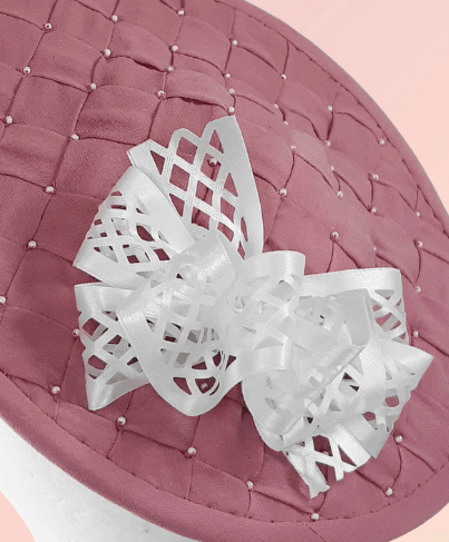 A picture of a Pink and White Saucer Hat by Melissa Rath Millinery.