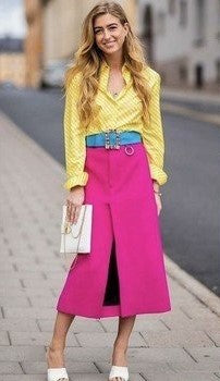 A picture of a woman wearing an outfit in a pink split complementary colour scheme.