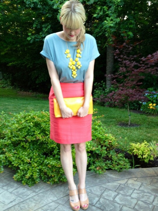 A picture of a woman wearing an outfit in a pink split complementary colour scheme.