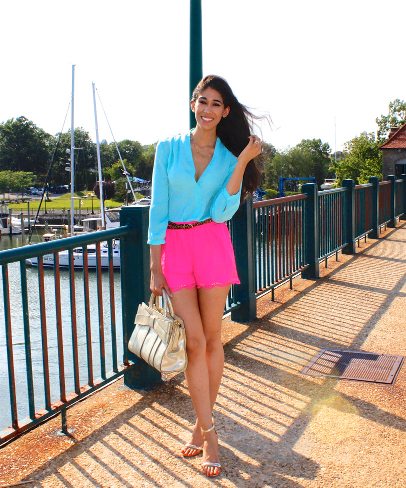 A picture of a woman wearing an outfit in a pink triadic colour scheme.