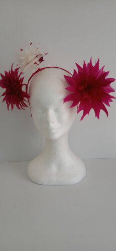 A picture of the pink and white feather flower headband by Melissa Rath Millinery.