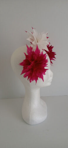 A picture of the pink and white feather flower headband by Melissa Rath Millinery.