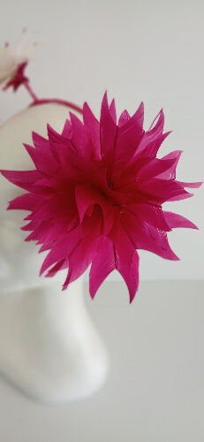 A picture of the pink and white feather flower headband by Melissa Rath Millinery.