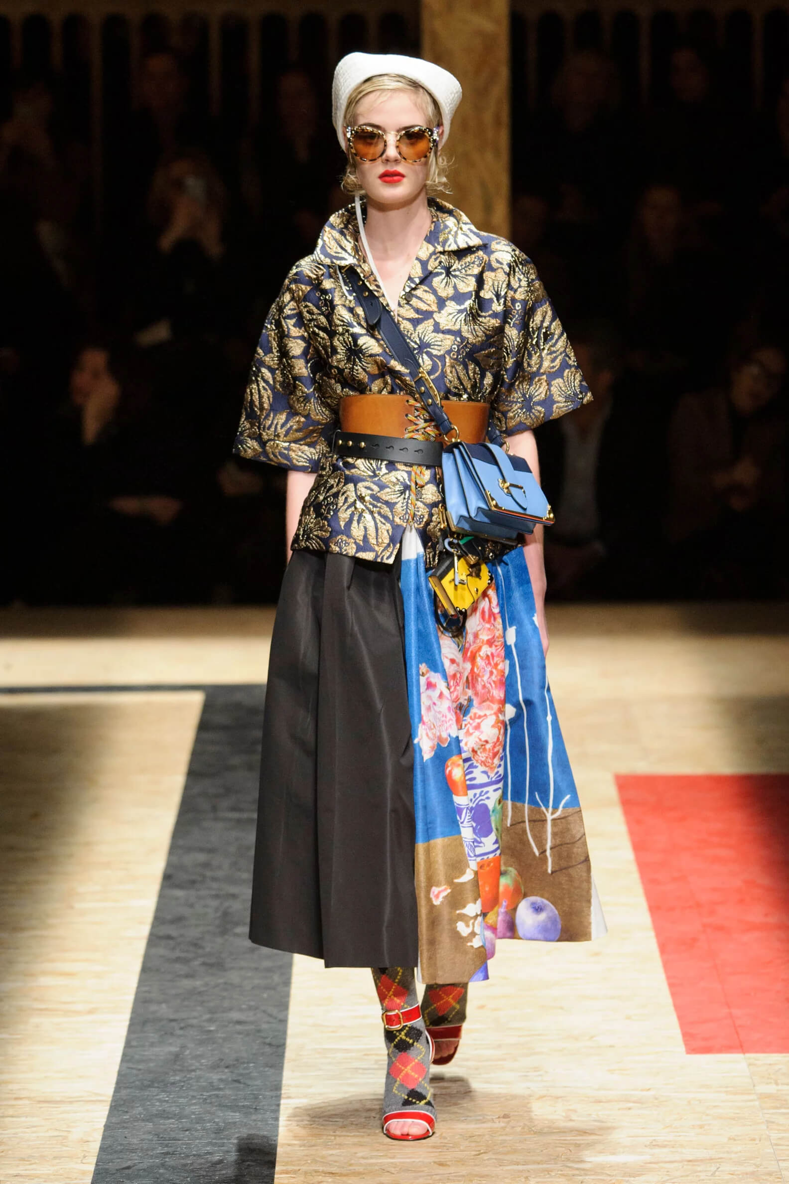 A picture of a model on the catwalk for the Prada 2016 catwalk show.