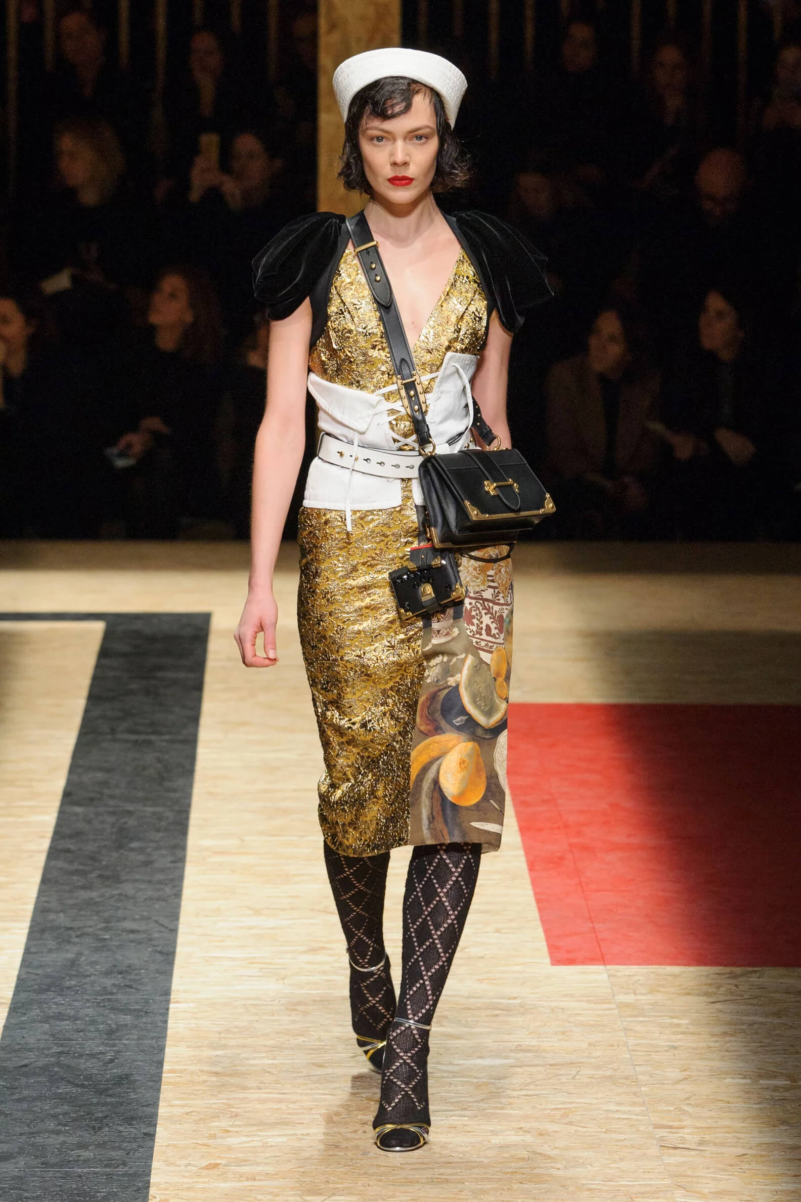 A picture of a model on the catwalk for the Prada 2016 catwalk show.
