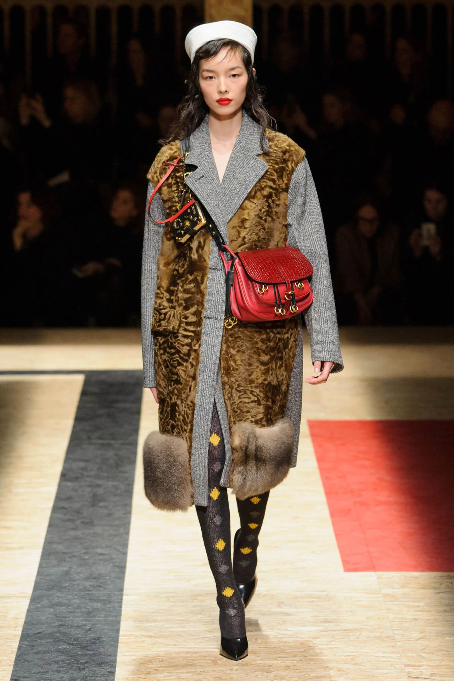 A picture of a model on the catwalk for the Prada 2016 catwalk show.