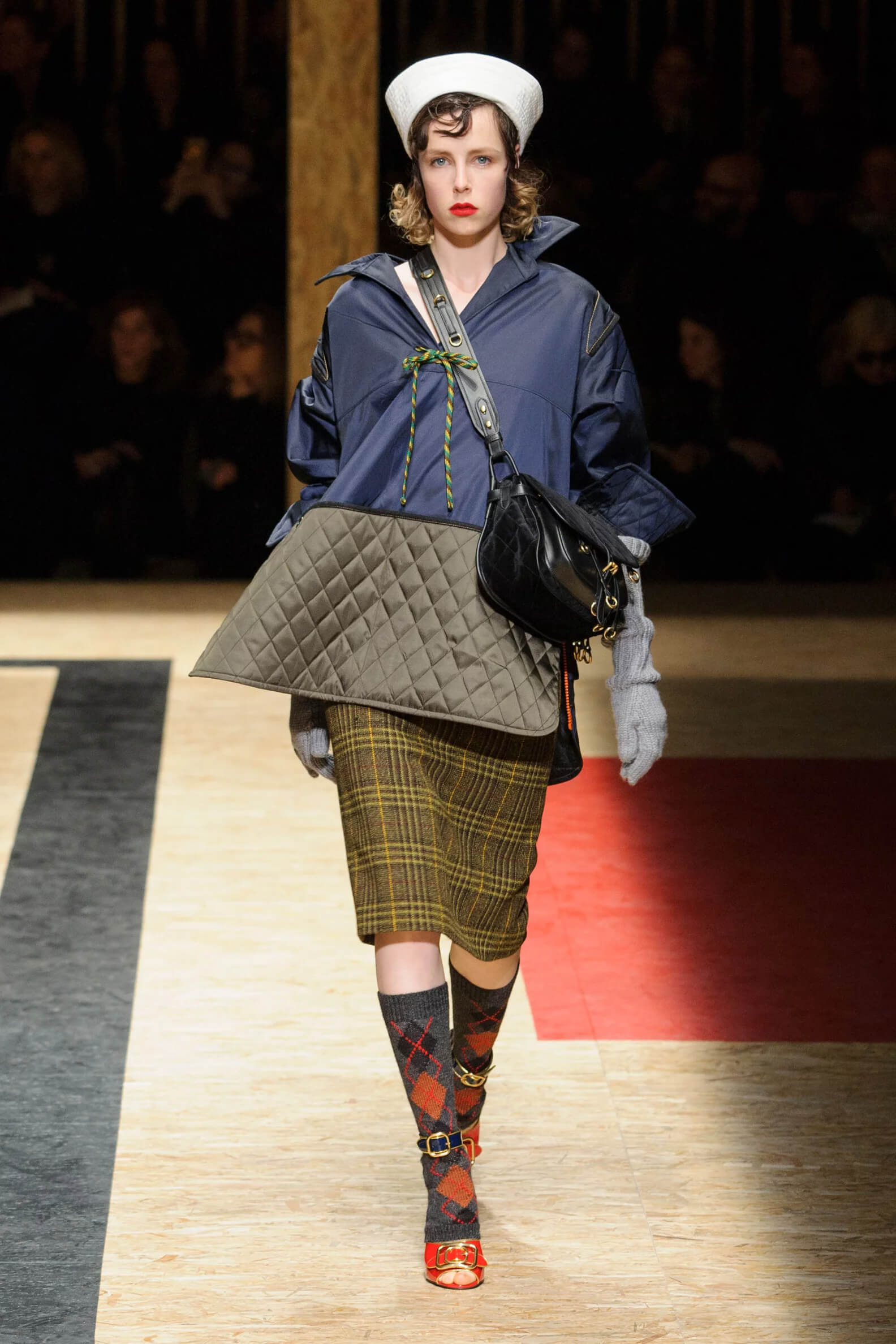 A picture of a model on the catwalk for the Prada 2016 catwalk show.